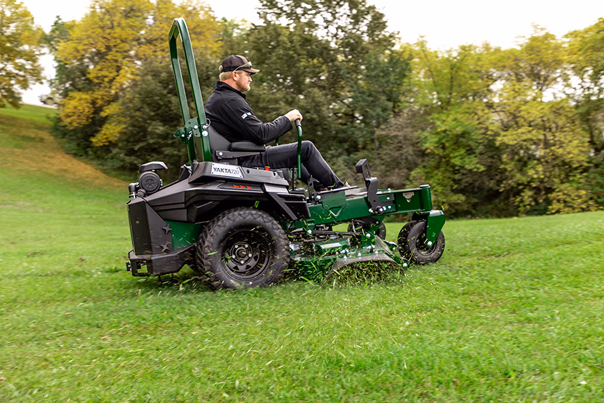 Homeowner mowing grass with Arrowquip mower